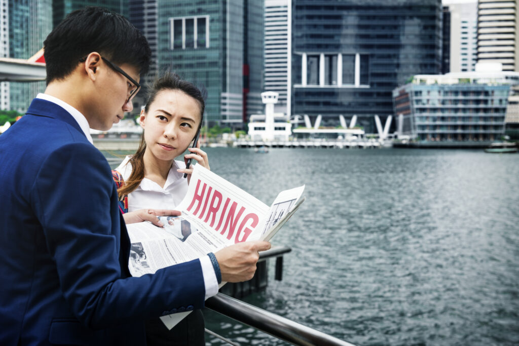 asian business people in a city working together